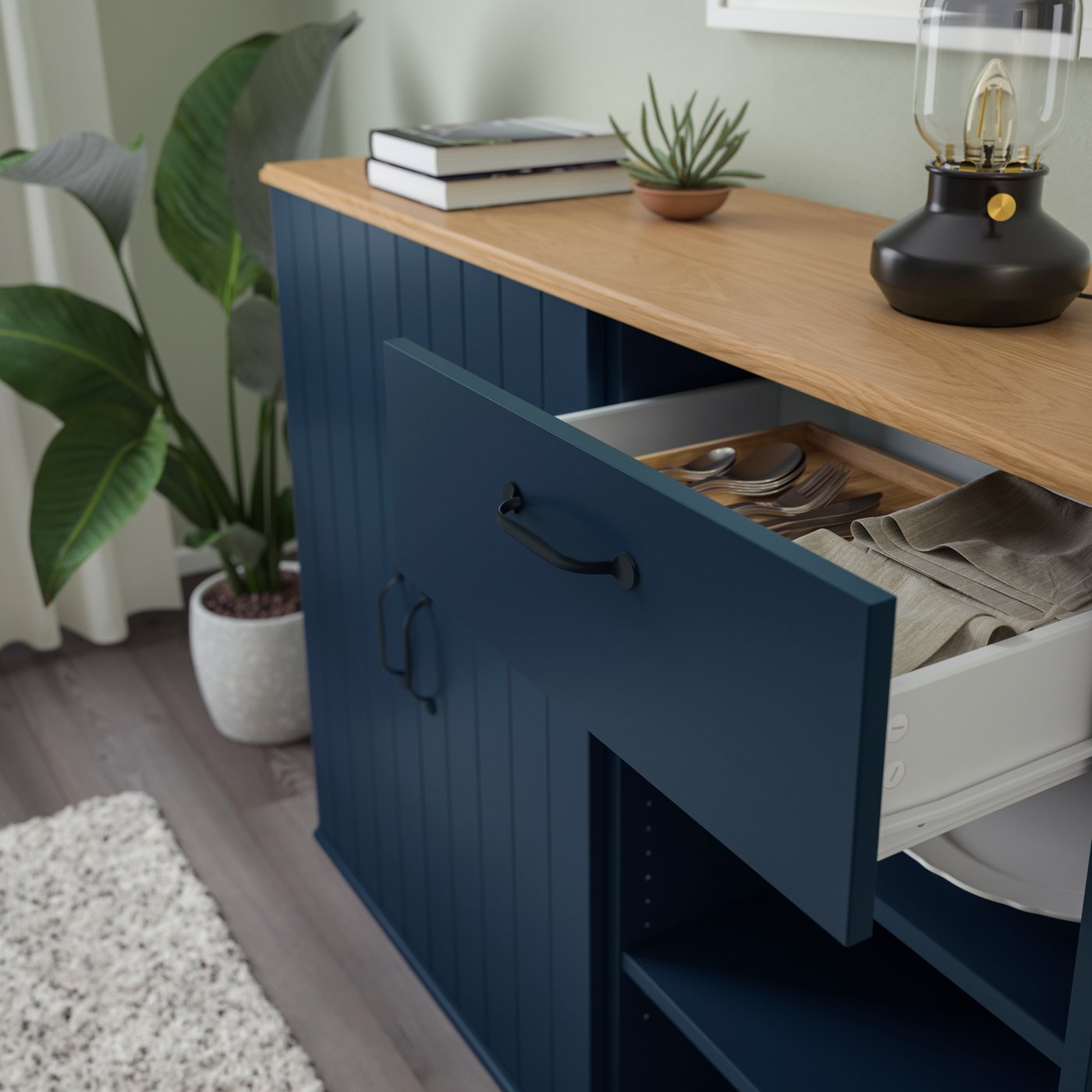 A black-blue SKRUVBY sideboard