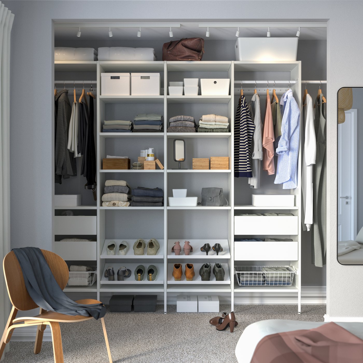 A white AURDAL wardrobe combination in the bedroom