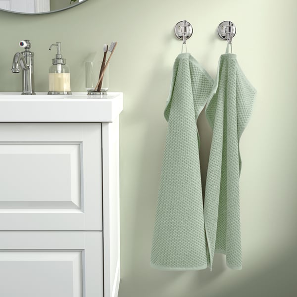 A pale grey-green GULVIAL hand towel