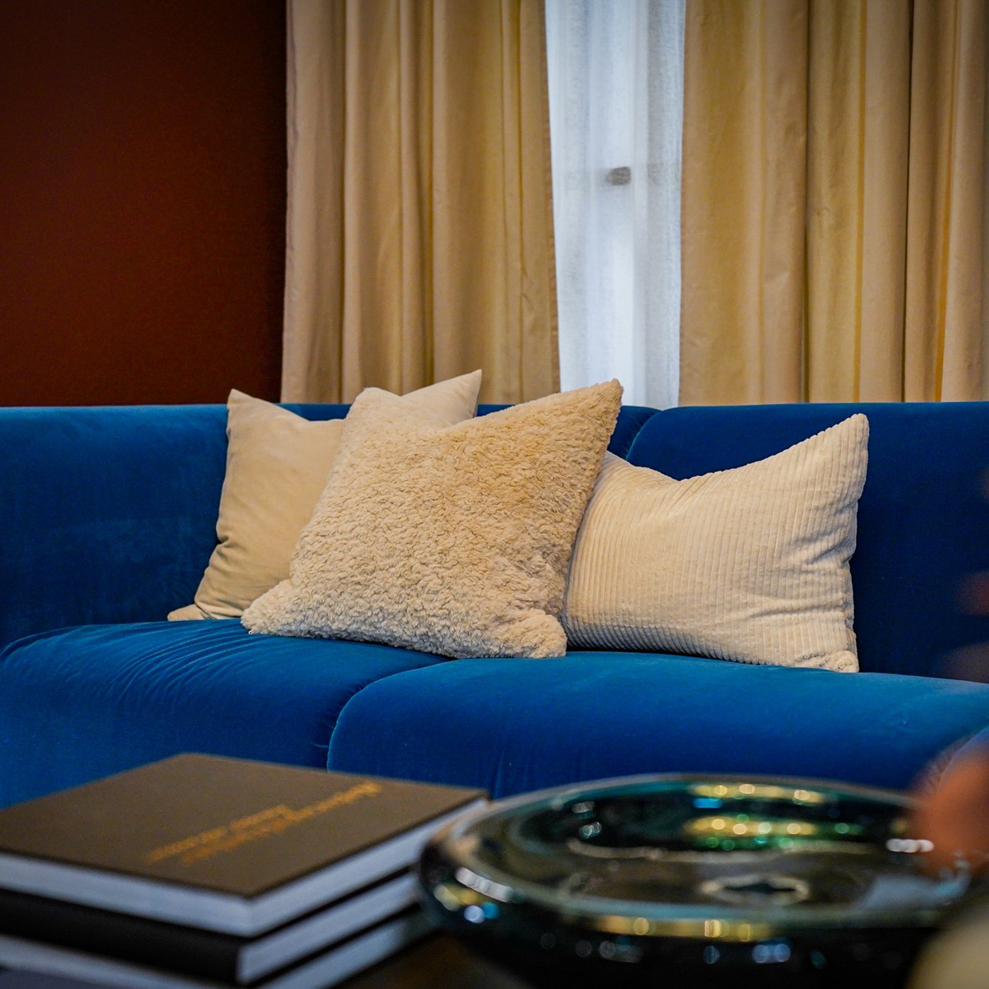 An Alhamn dark turquoise STOCKHOLM 2025 3-seat sofa featuring ASVEIG cushion cover, NATNAVA cushion cover and SANELA cushion cover.