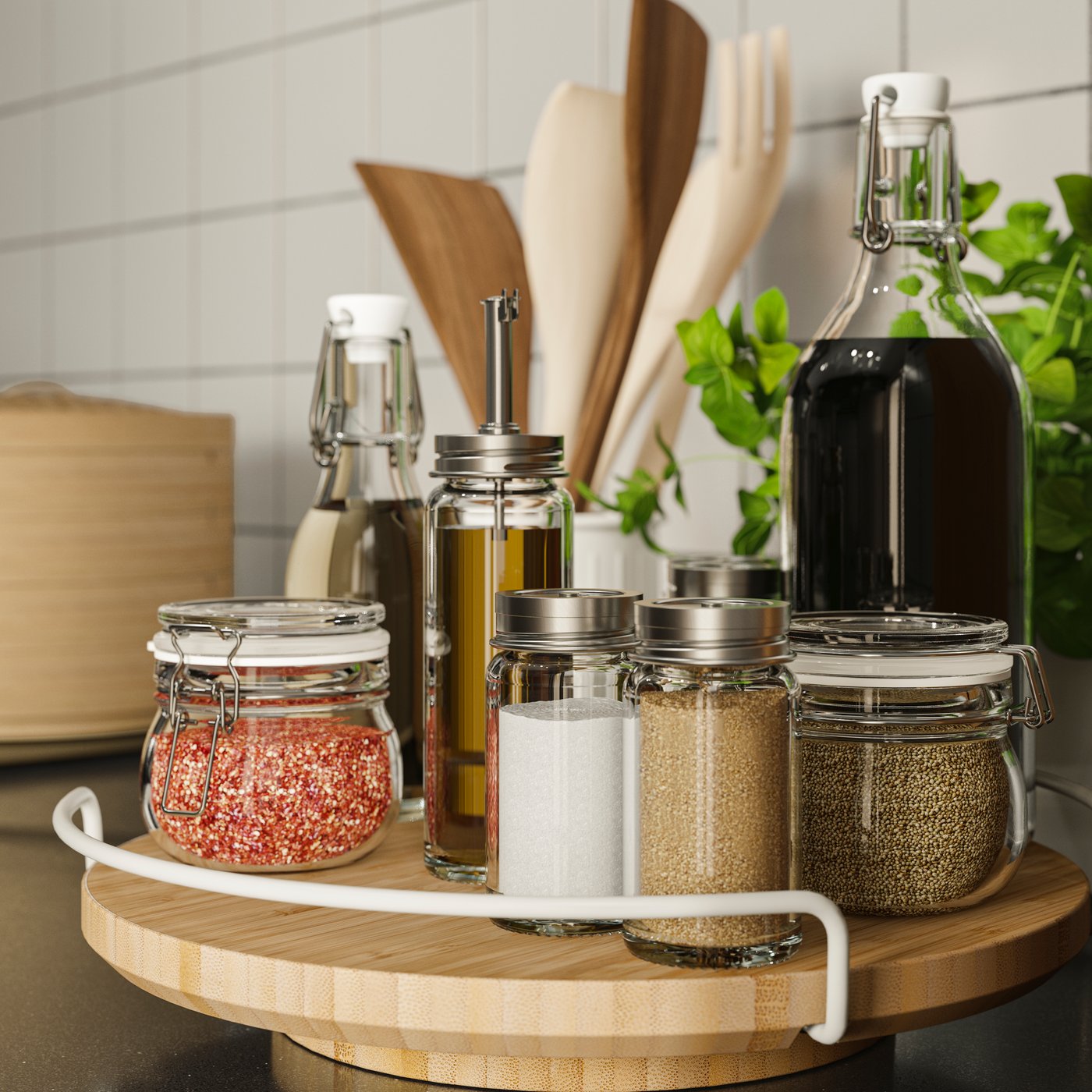 APTITLIG lazy susan on a kitchen counter, neatly displaying kitchen essentials such as spices, oil bottles, and utensils.
