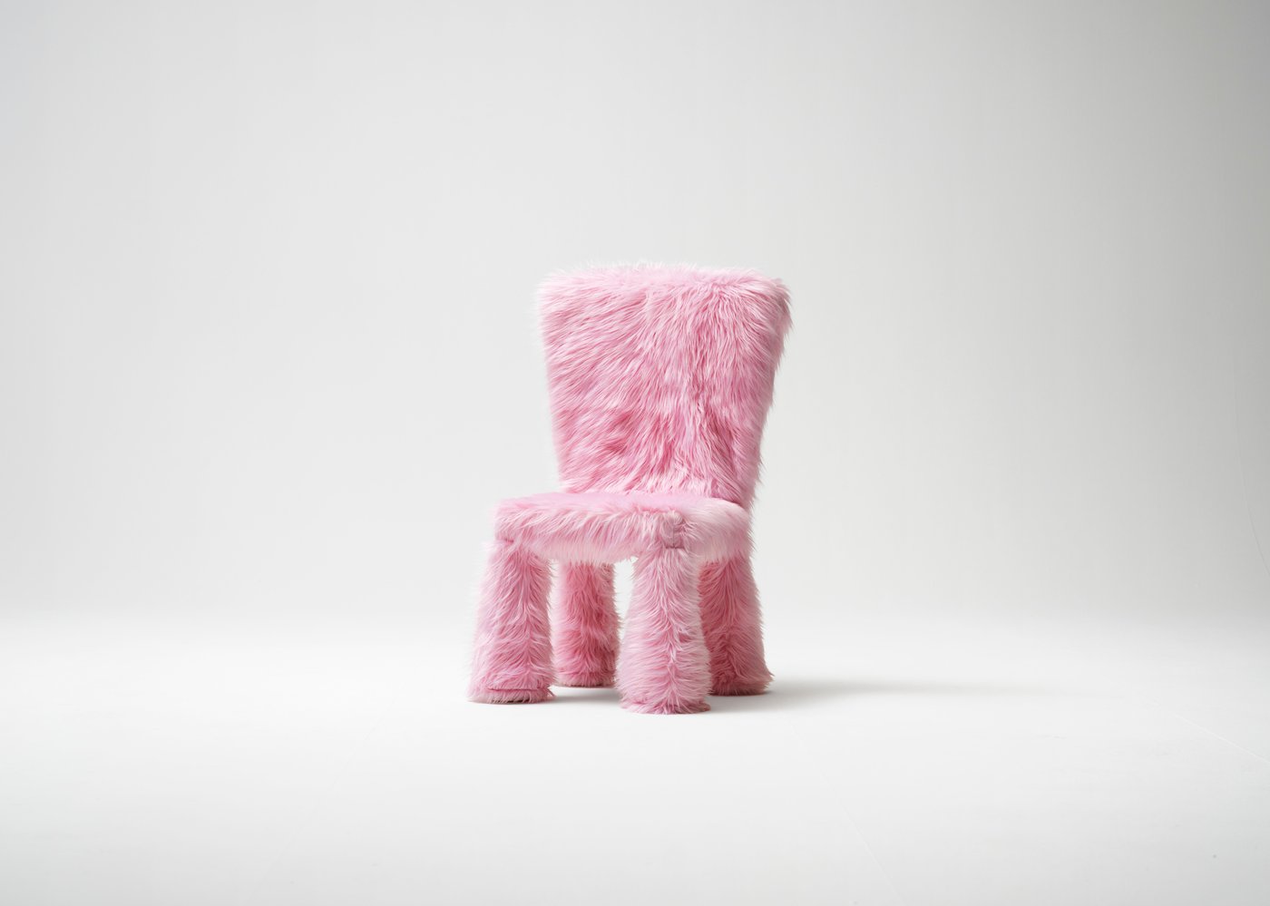 A faux fur/pink GREJSIMOJS cover for children's chair