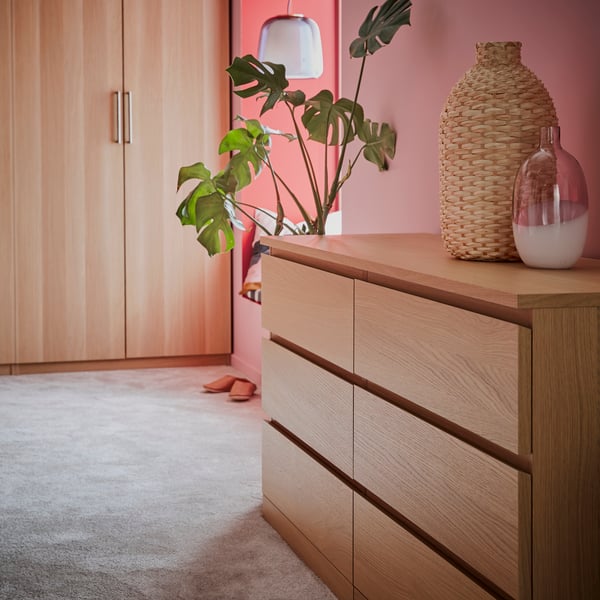 A white stained oak veneer MALM chest of 6 drawers in the bedroom