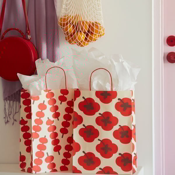 A mixed patterns red FÖSSTA gift bag
