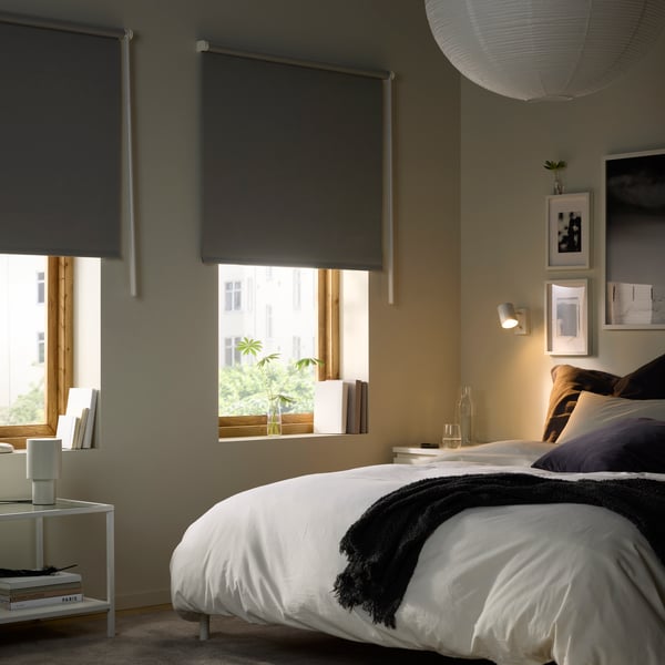 A grey FRIDANS block-out roller blind