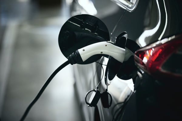 Close-up of an electric car in a charging station.