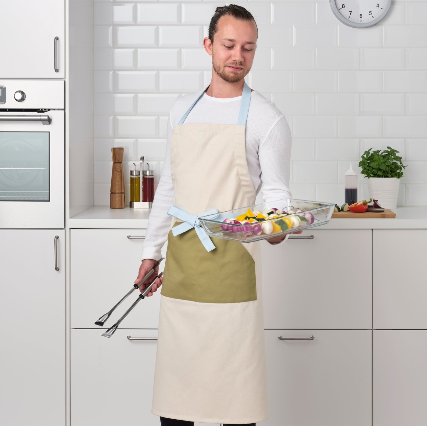 An off-white GRILLTIDER apron
