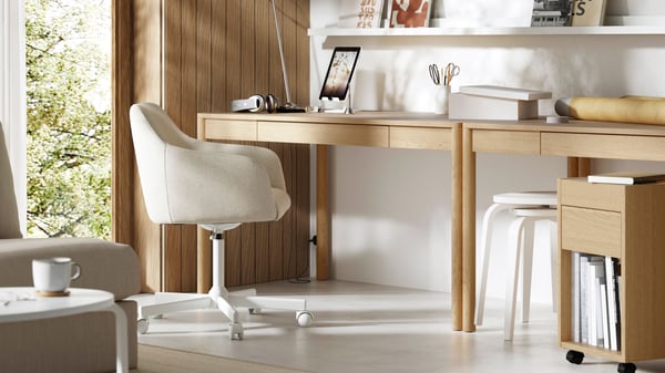 A light, stylish home office with a TONSTAD desk and a light-beige desk chair.