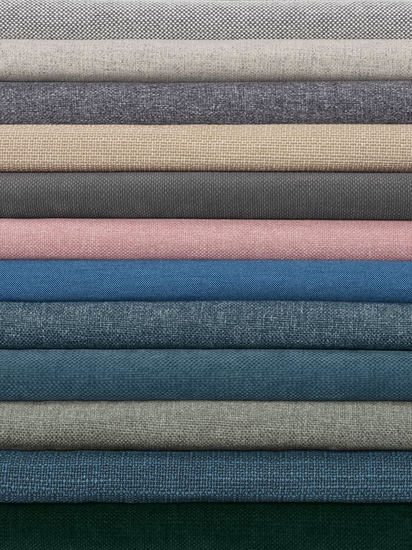 Various types of IKEA+ sofa covers stacked on top of each other.