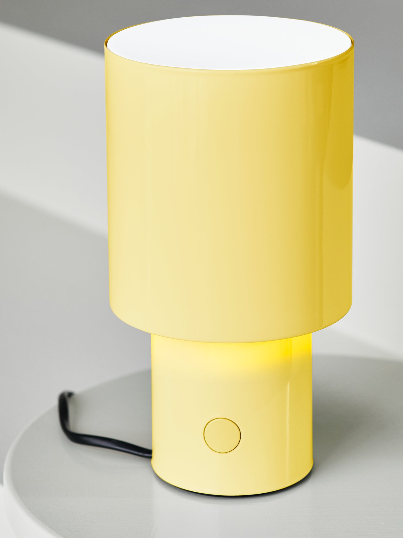 Close-up of a yellow SPETSBOJ table lamp.