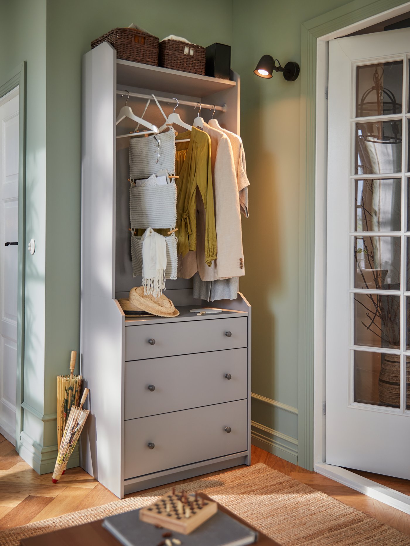 A grey NORDRANA hanging storage in the hallway