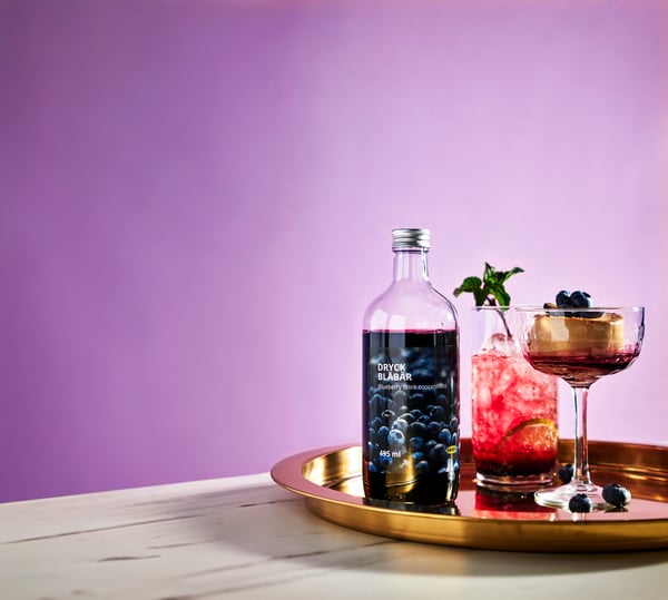 A clear glass FRÖJDA champagne coupe