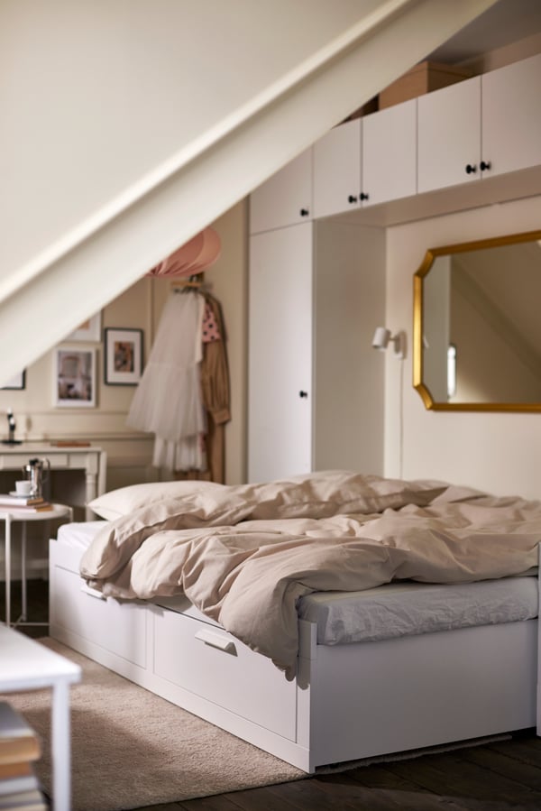 A white BRIMNES day-bed frame with 2 drawers in the bedroom