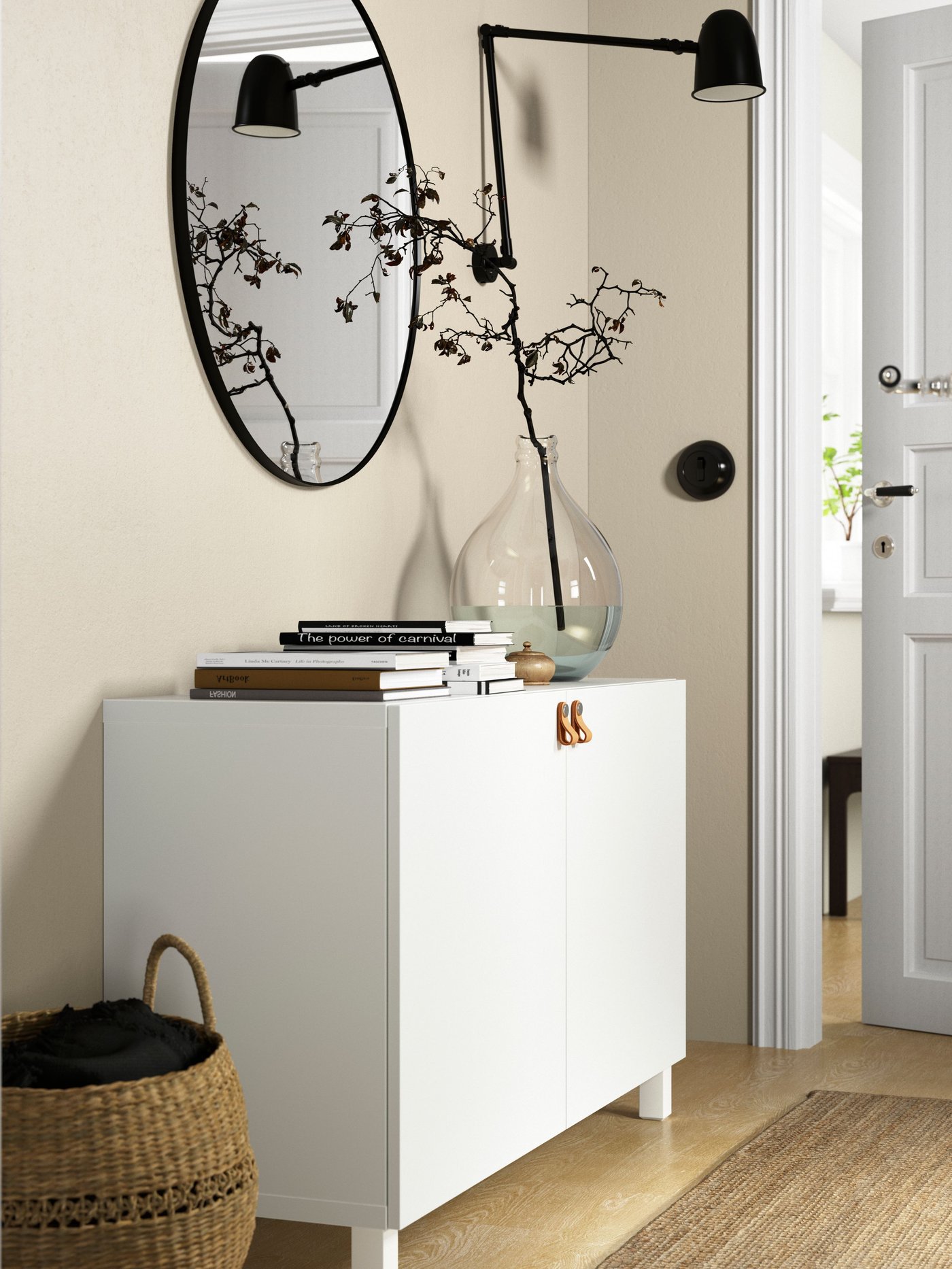 A white/Lappviken/Stubbarp white BESTÅ storage combination with doors in the hallway