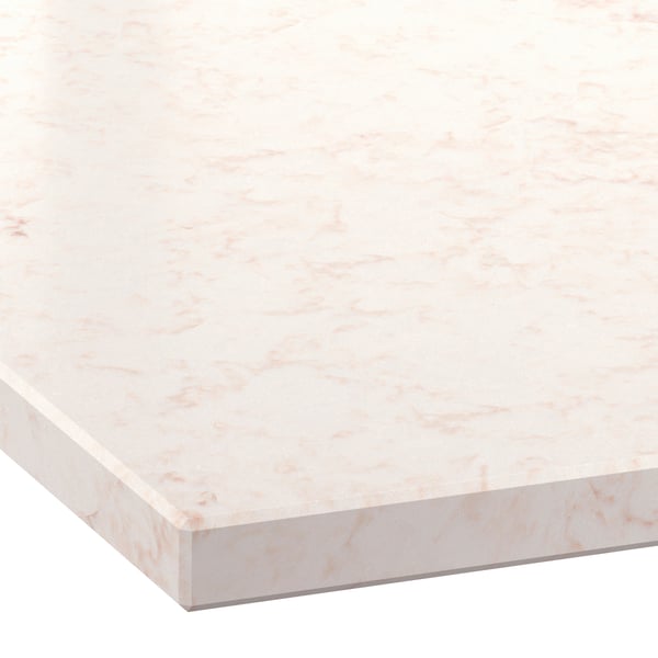 Close-up of a light marble-look countertop with soft beige veining and a glossy finish.