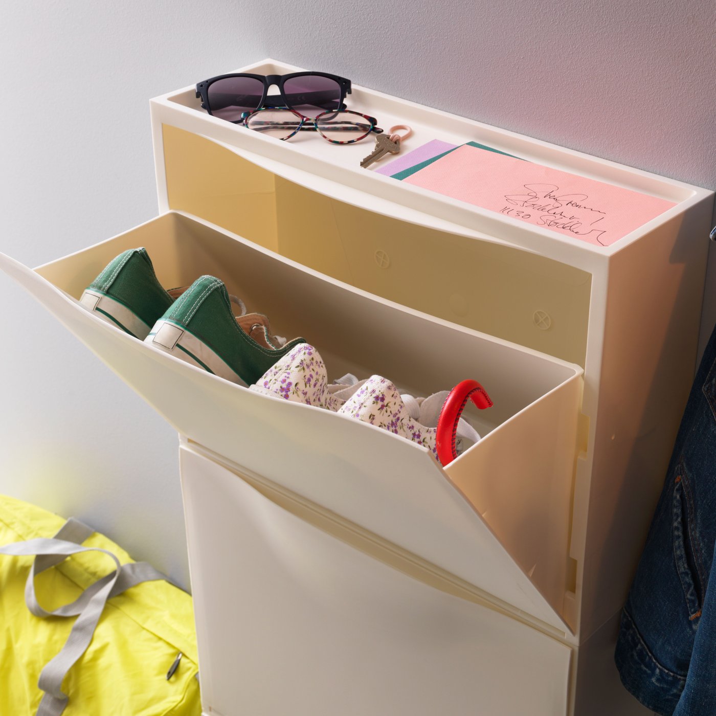 A white TRONES shoe cabinet/storage