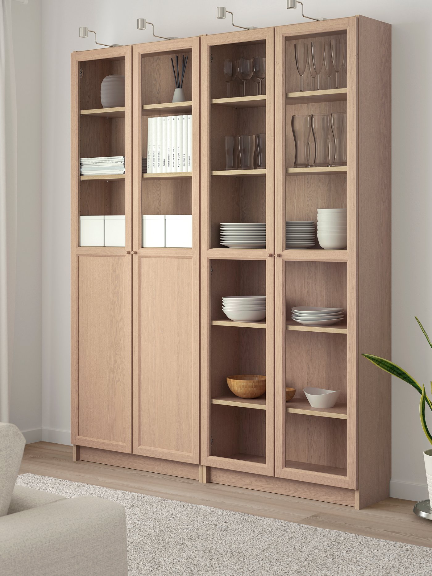 A white stained oak veneer/glass BILLY bookcase with panel/glass doors