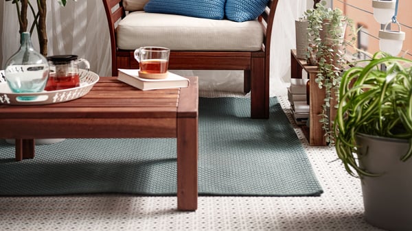 A brown stained ÄPPLARÖ table/stool section, outdoor outside