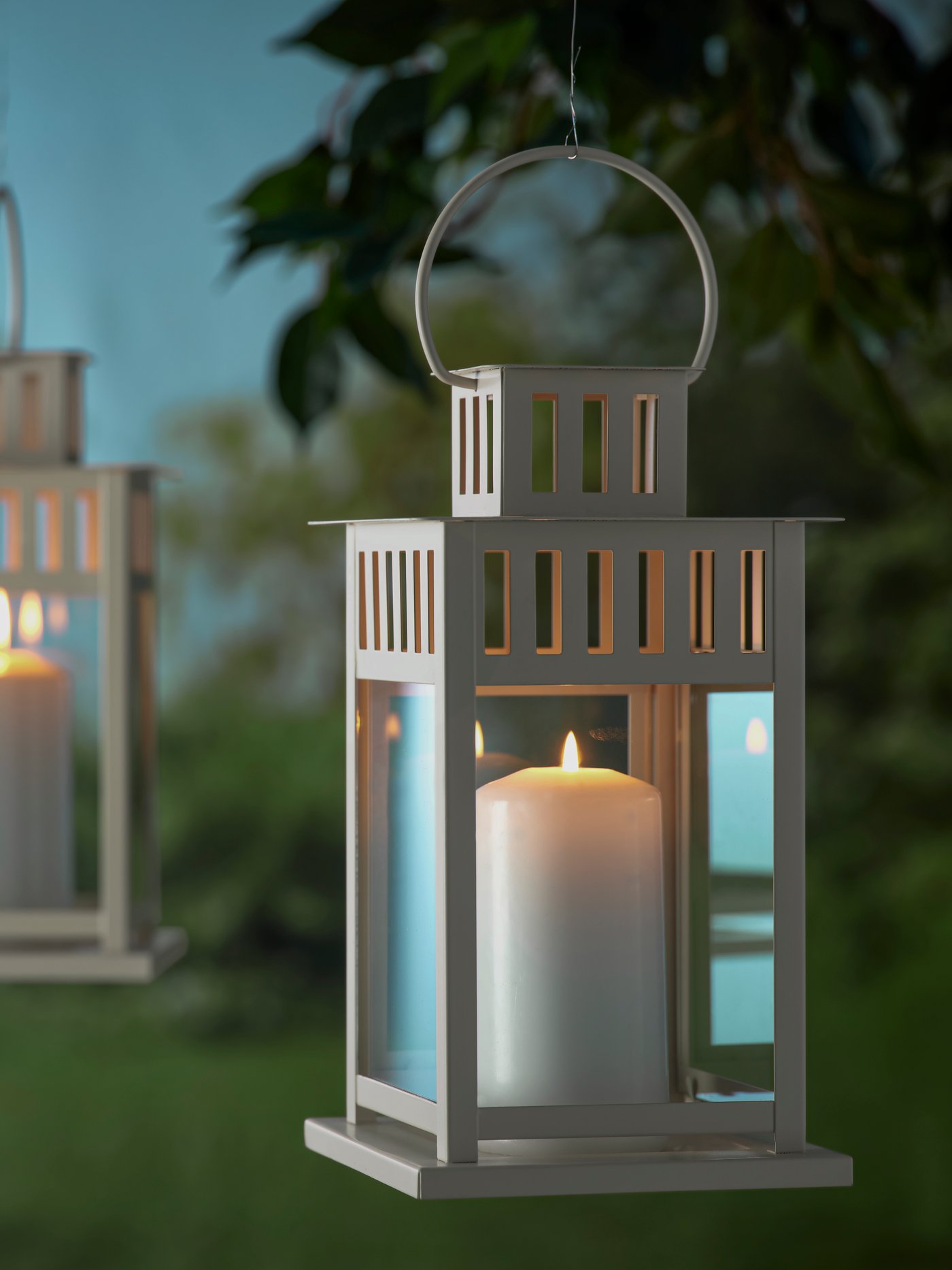 A beige BORRBY lantern for pillar candle, in/out
