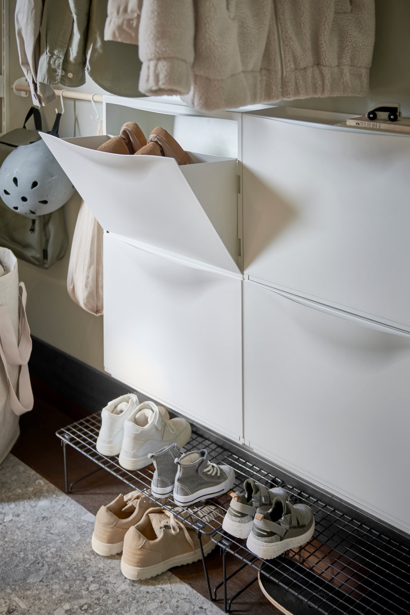 A white TRONES shoe cabinet/storage