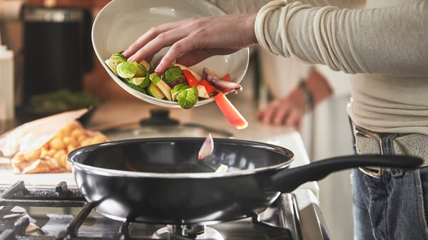 A non-stick coating black HEMLAGAD sauté pan with lid