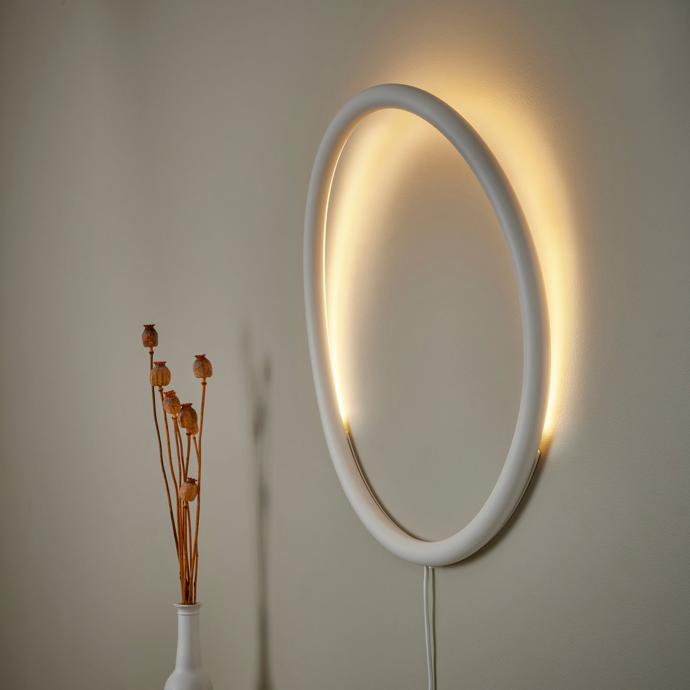 A white metal/circle VARMBLIXT LED wall lamp