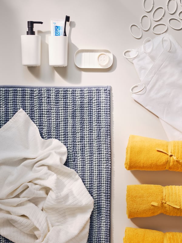 A white HASSJÖN shower curtain ring