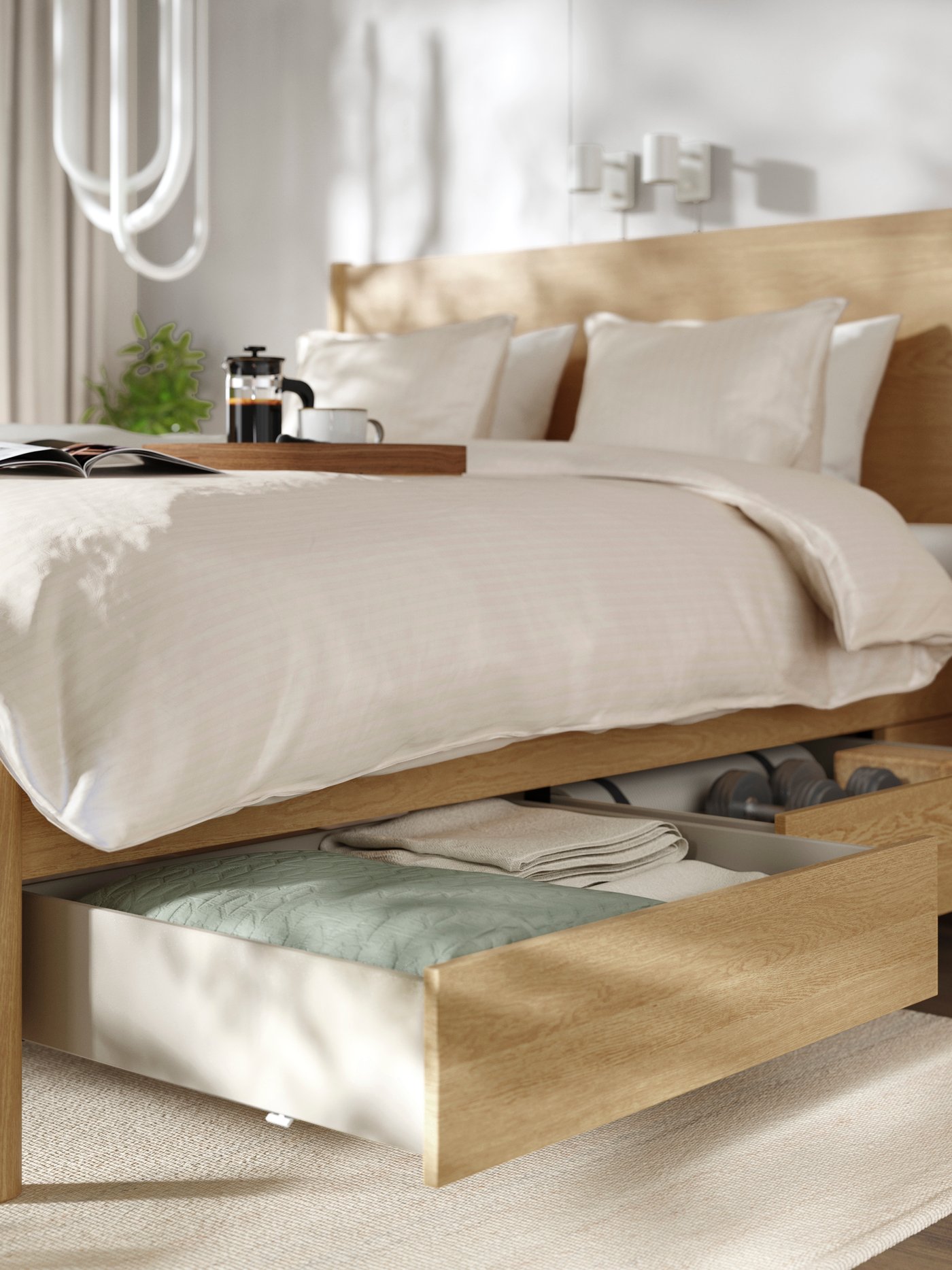 An oak veneer/Luröy TONSTAD bed frame with storage in the bedroom