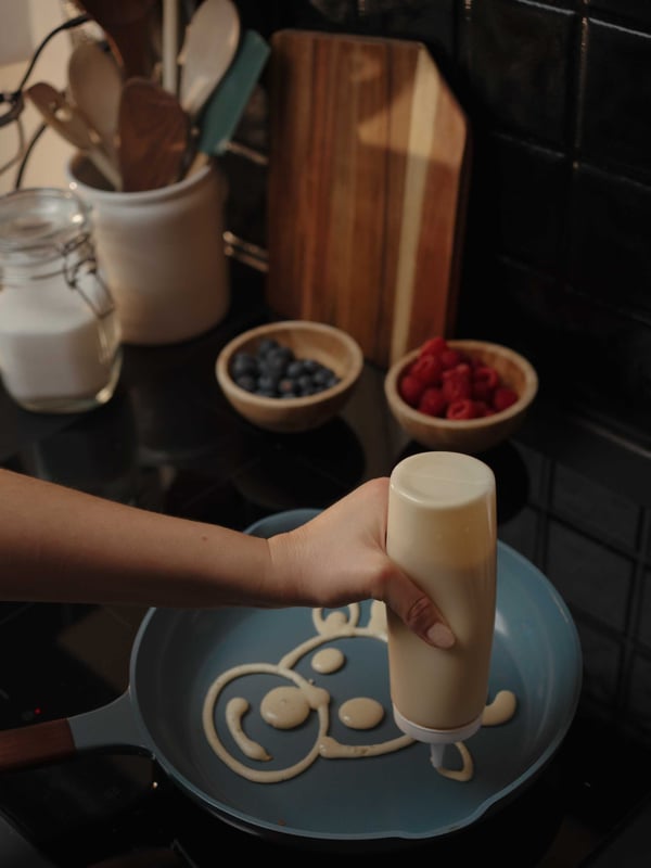A clear glass KORKEN jar with lid