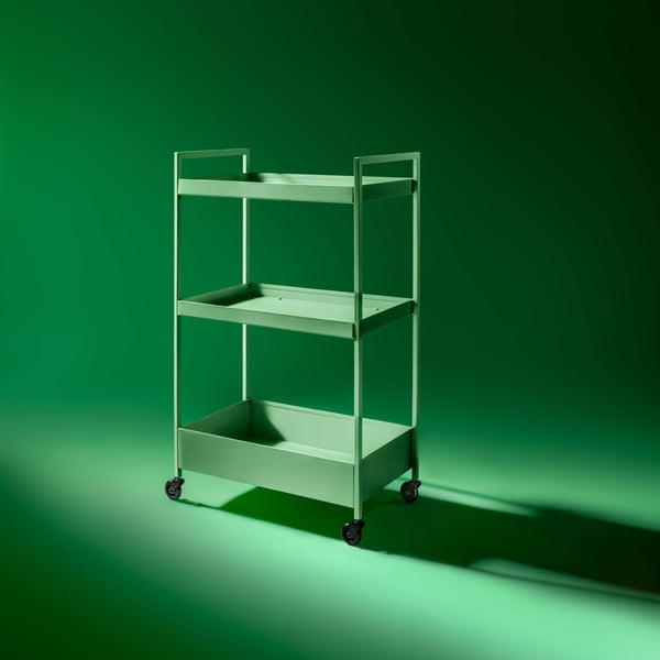 Green NISSAFORS trolley in a green background.