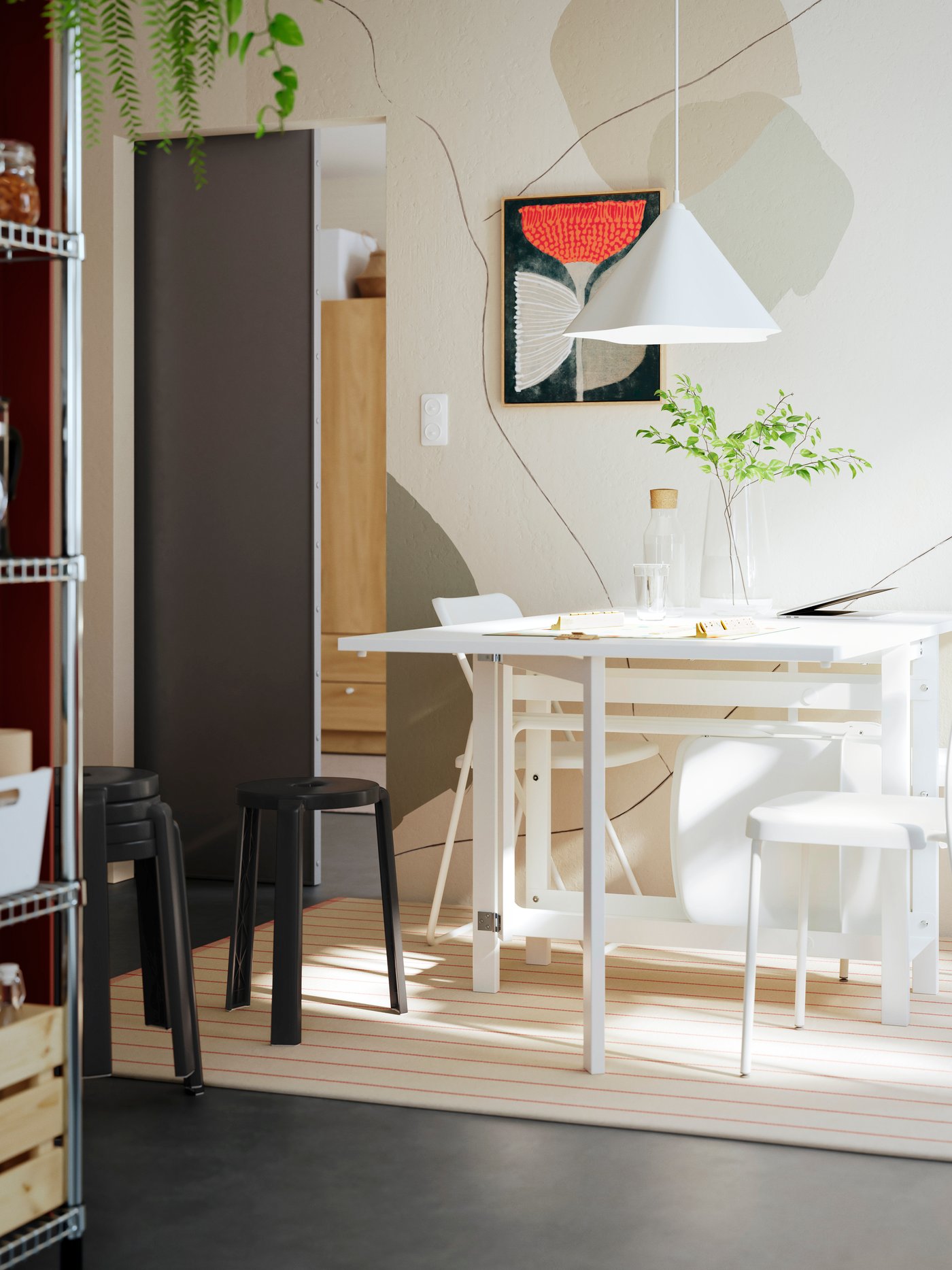 A bright dining area featuring a white dining table with two chairs and a black bar stool, surrounded by light tones.