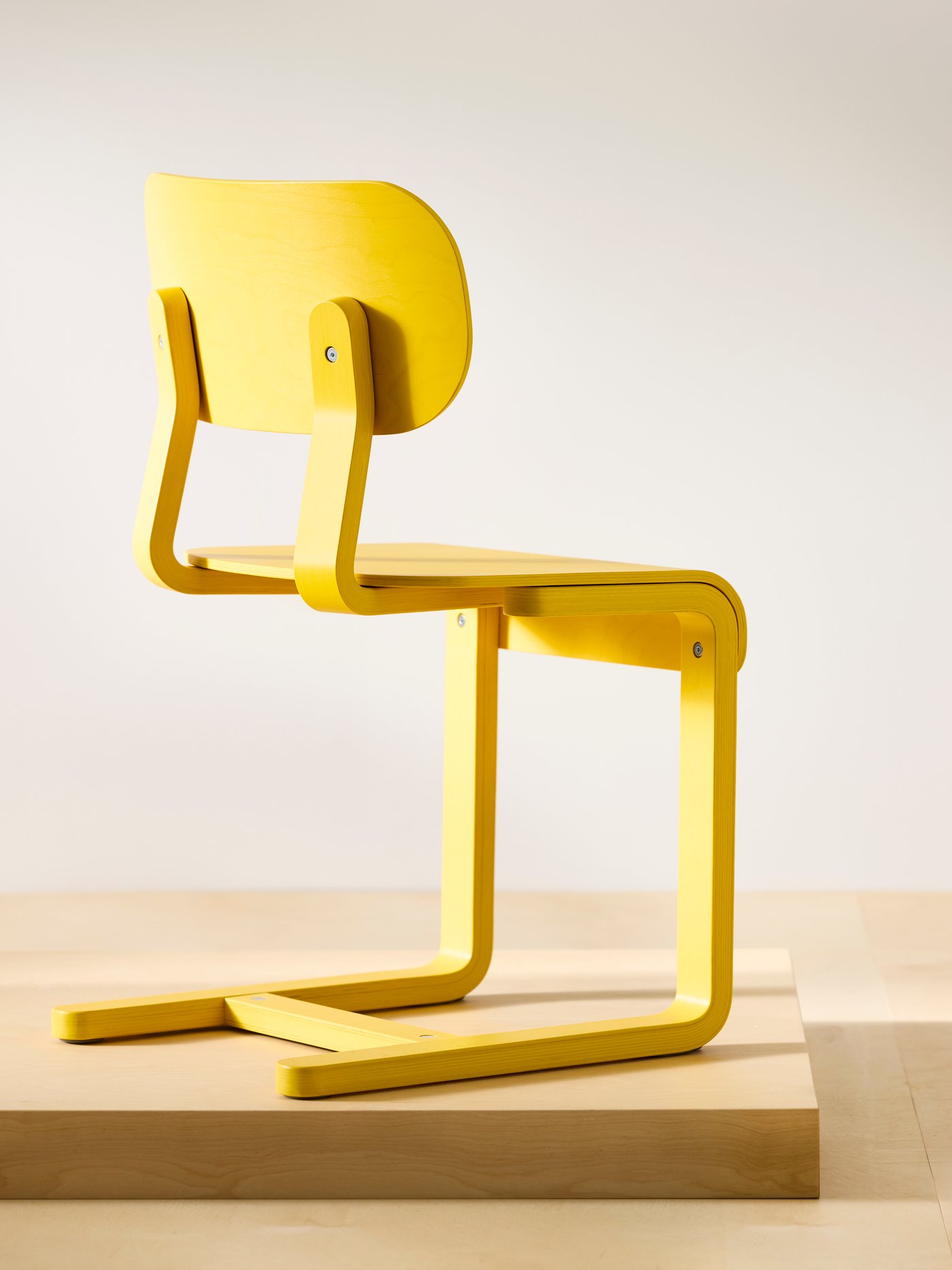 An yellow/birch veneer LYCKAN chair