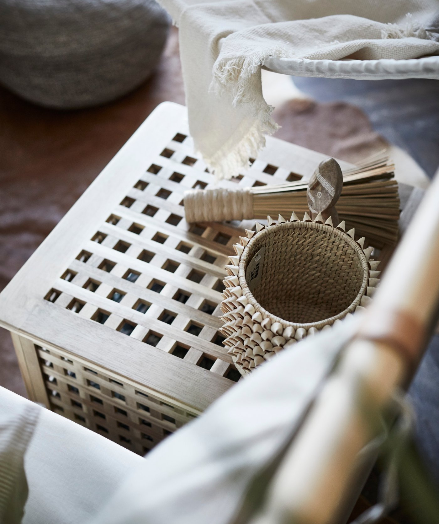 An acacia HOL side table in the bedroom