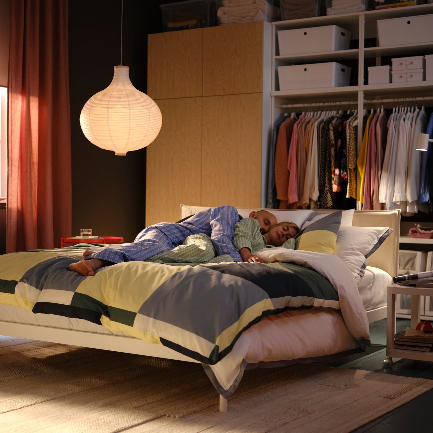A white PLATSA open clothes hanging unit in the bedroom