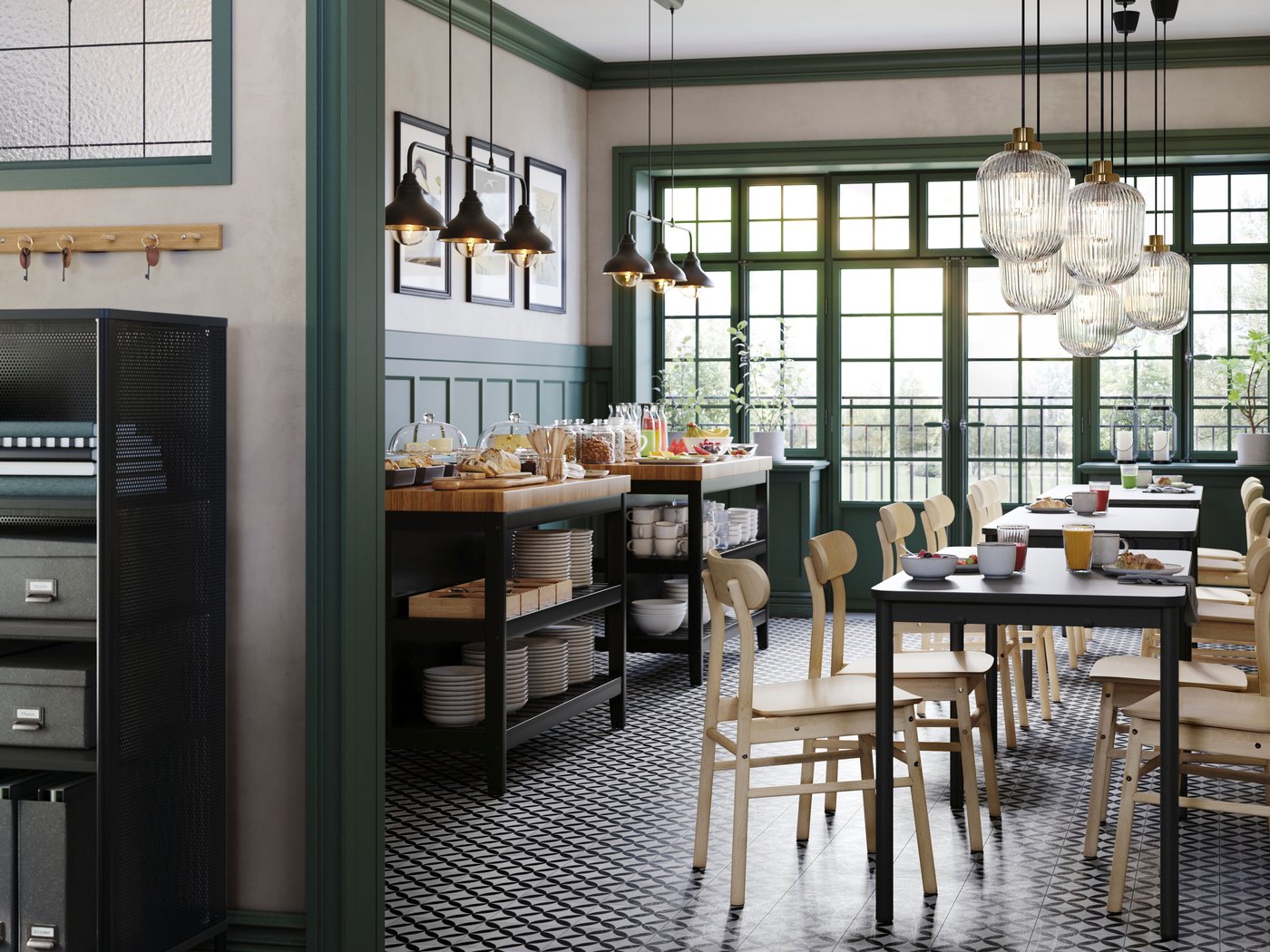 A café with green wall panels and TOMMARYD tables, birch RÖNNINGE chairs and two VADHOLMA kitchen islands.