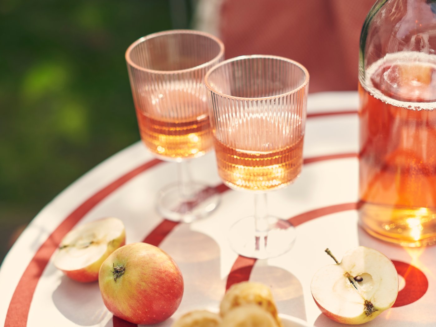 A transparent plastic KALLSINNIG wine glass