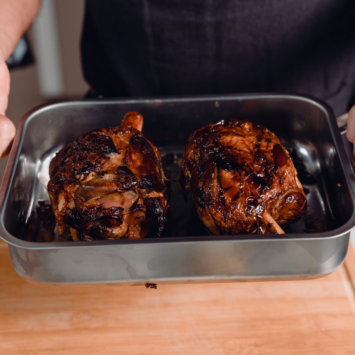 Chef Carlos Afonso preparing pork knuckle with mashed potatoes