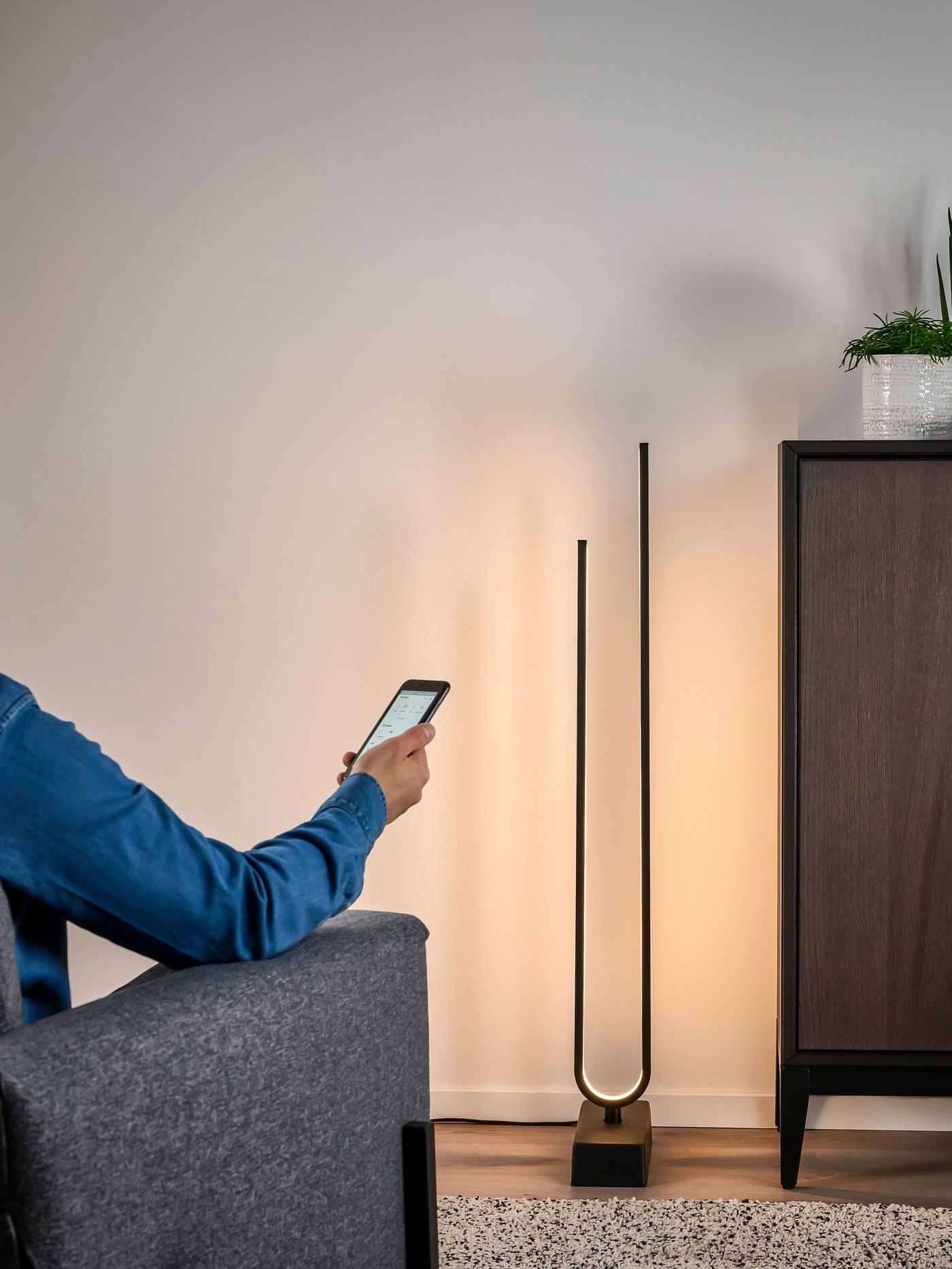 A smart black PILSKOTT LED floor lamp