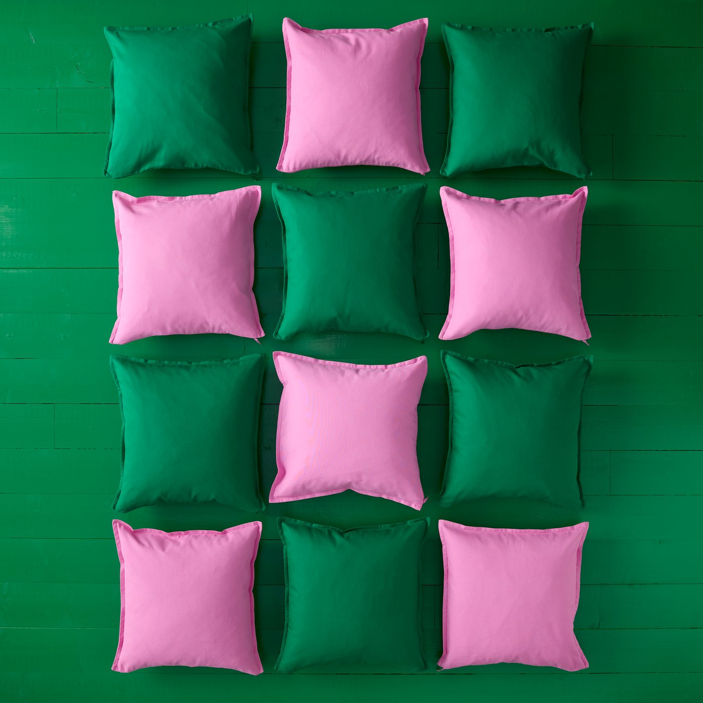 A green GURLI cushion cover