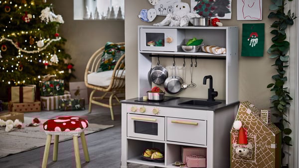A grey SILLTRUT kitchen for children in the living room