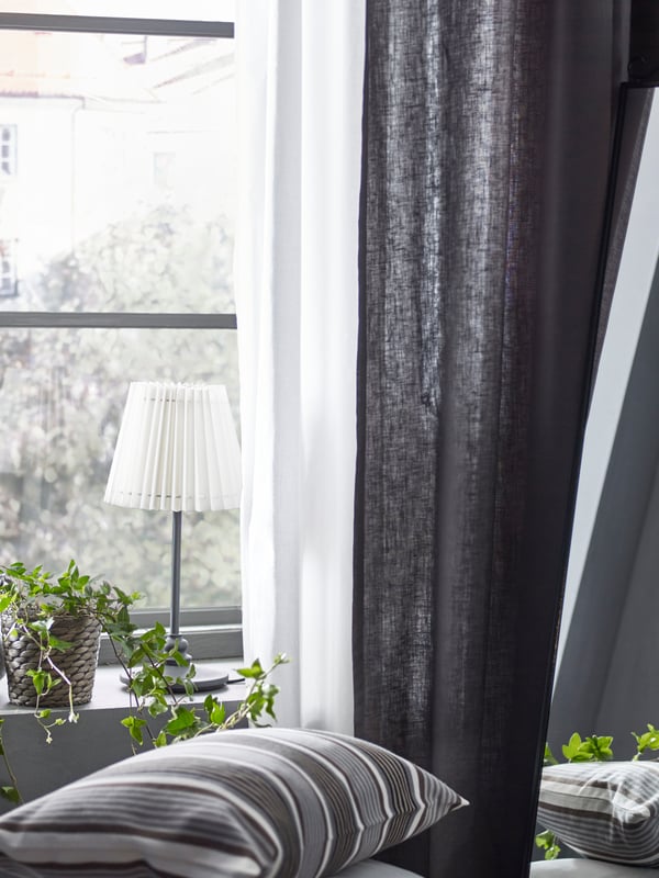 A white PÄRLBLAD curtains, 1 pair in the bedroom