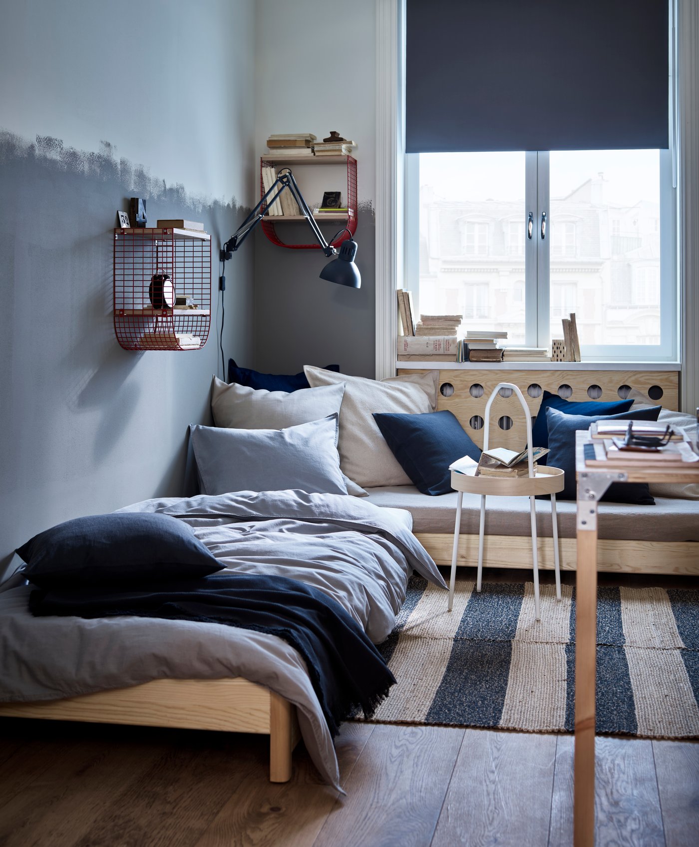 A dark blue-grey JOFRID throw in the bedroom