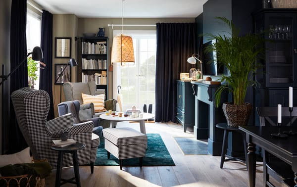 A black KRAGSTA nest of tables in the living room