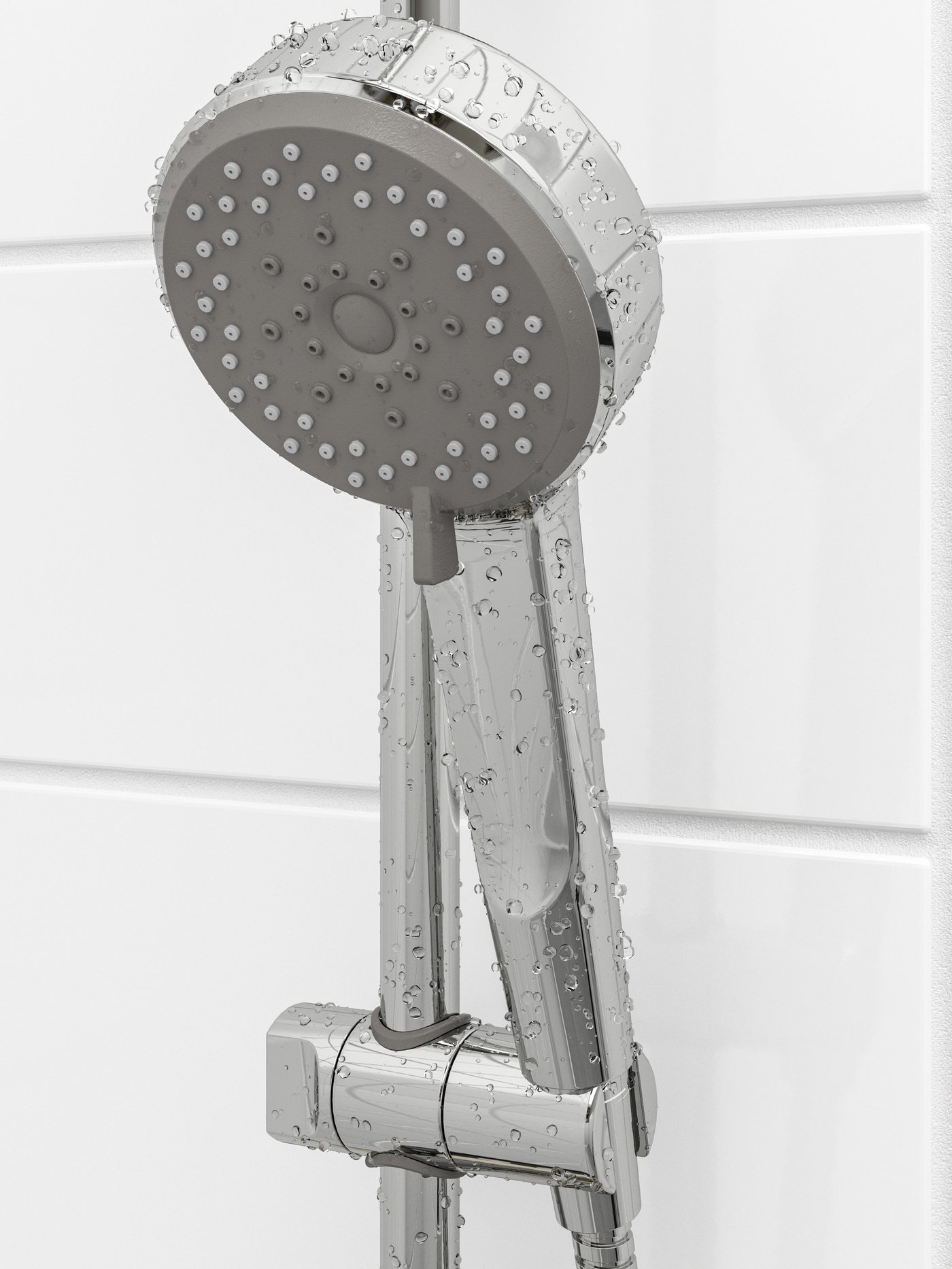 A close-up of a BROGRUND hand shower in stainless steel with different spray functions shown in a white tiles bathroom.
