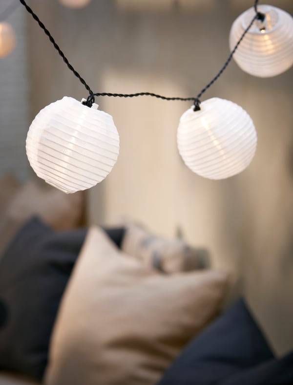 An outdoor solar-powered/ball white SOLARVET LED lighting chain with 24 lights in the living room