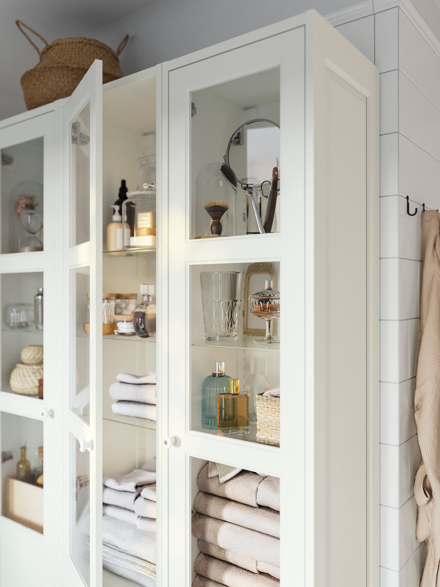 A white TÄNNFORSEN high cabinet with door
