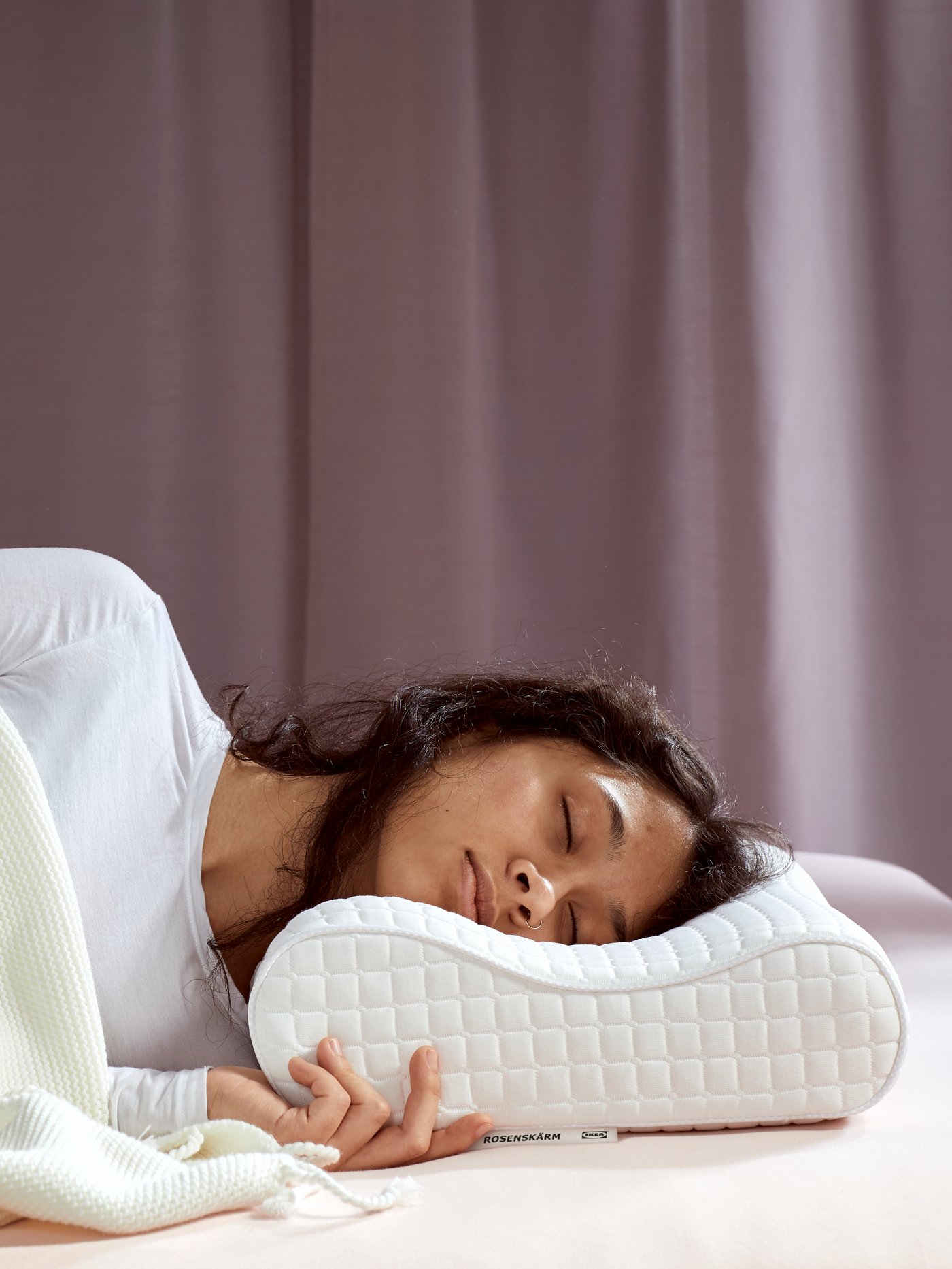 A ROSENSKÄRM ergonomic pillow, side/back sleeper in the bedroom