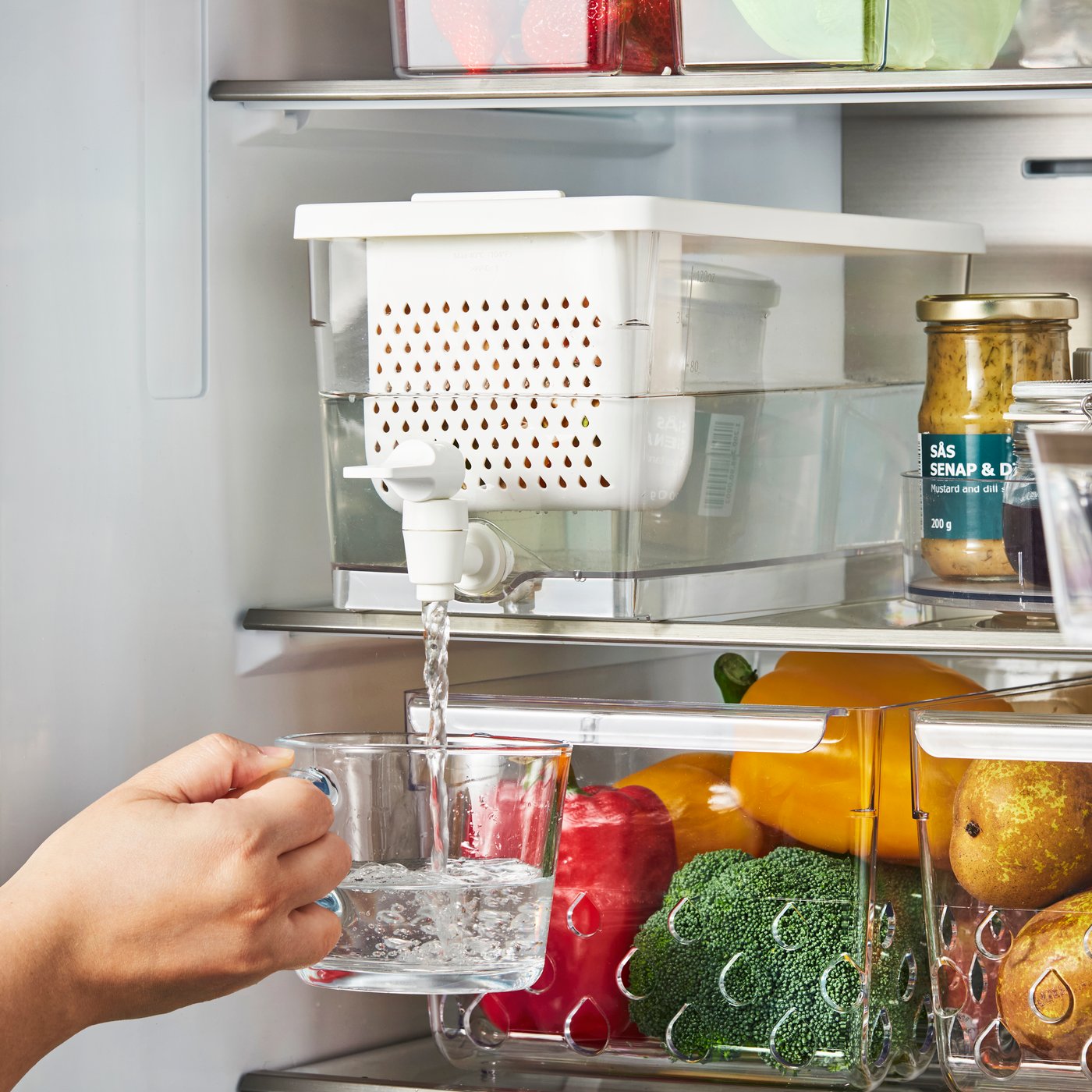 A transparent KLIPPKAKTUS container w tap disp for fridge