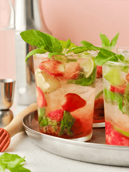 Strawberry Mojito mocktail in a glass with fresh mint.
