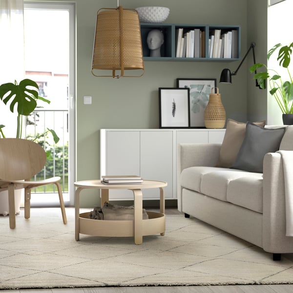 A beige TVERSTED rug, low pile